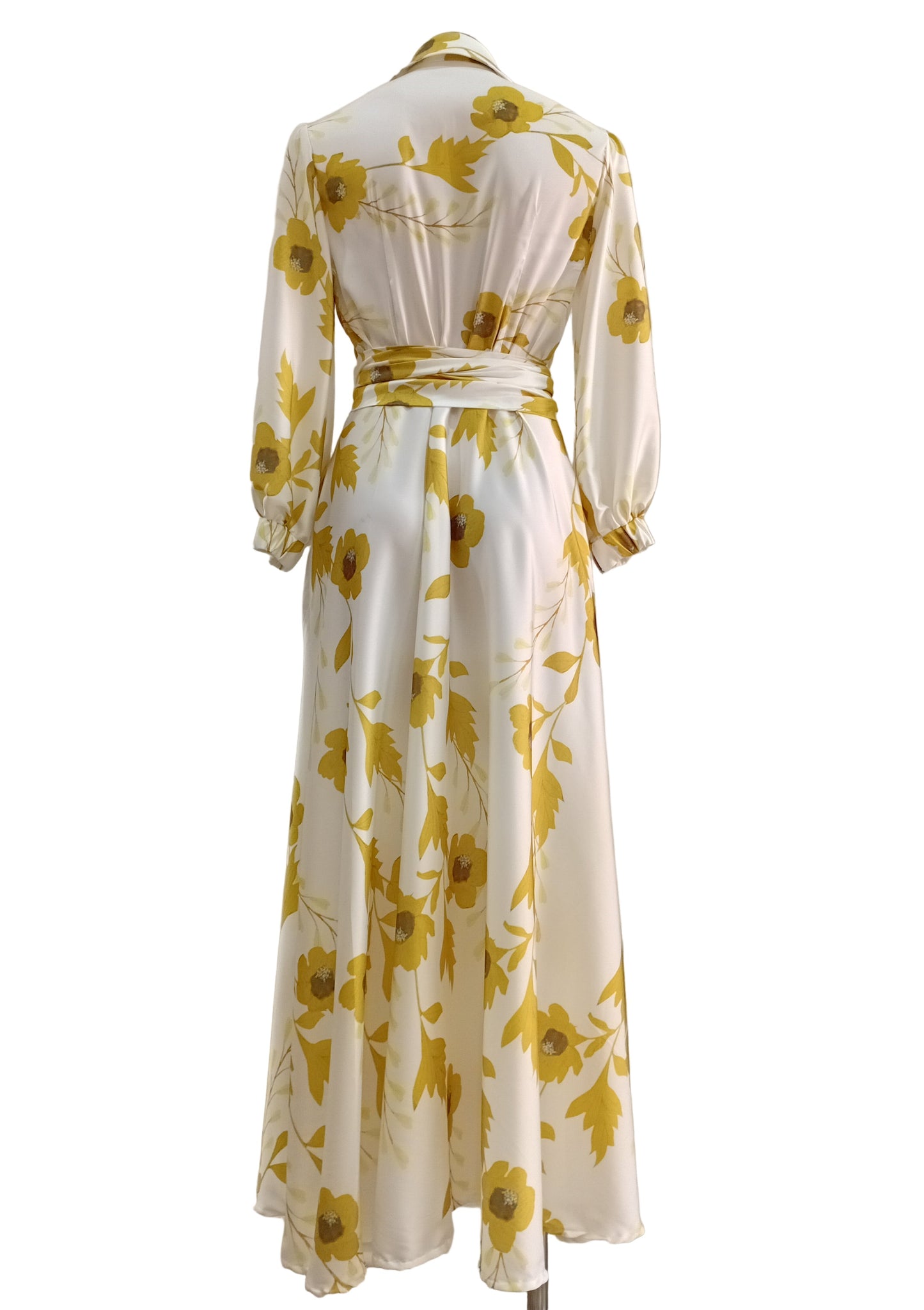 Shirtwaister dress with yellow floral pattern on a white background