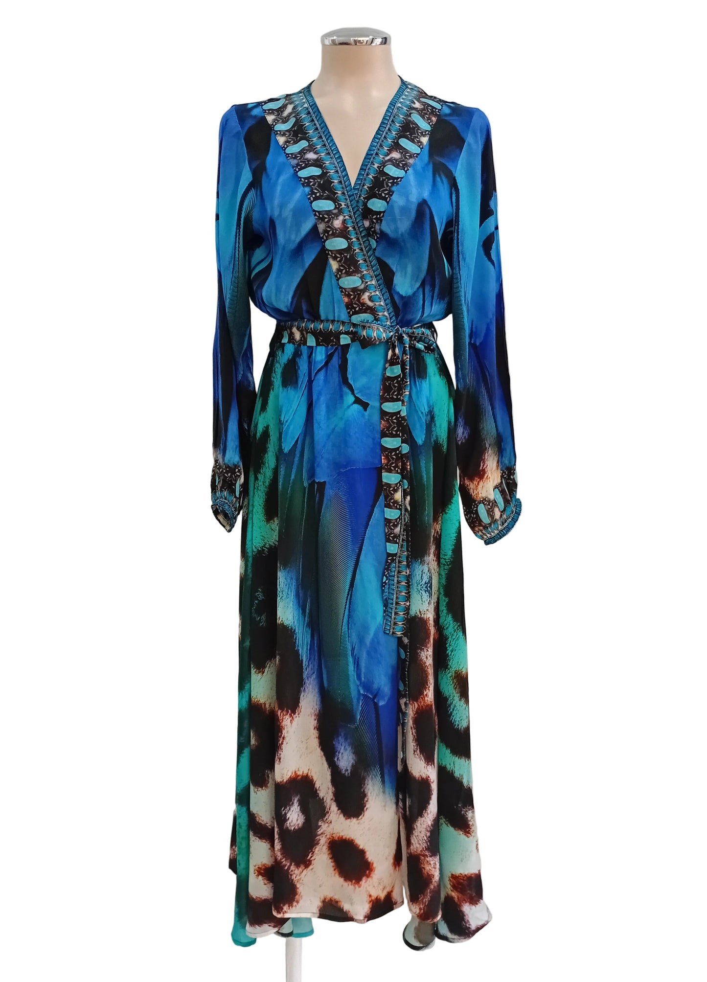 Blue coloured pattern wrap dress against a white background