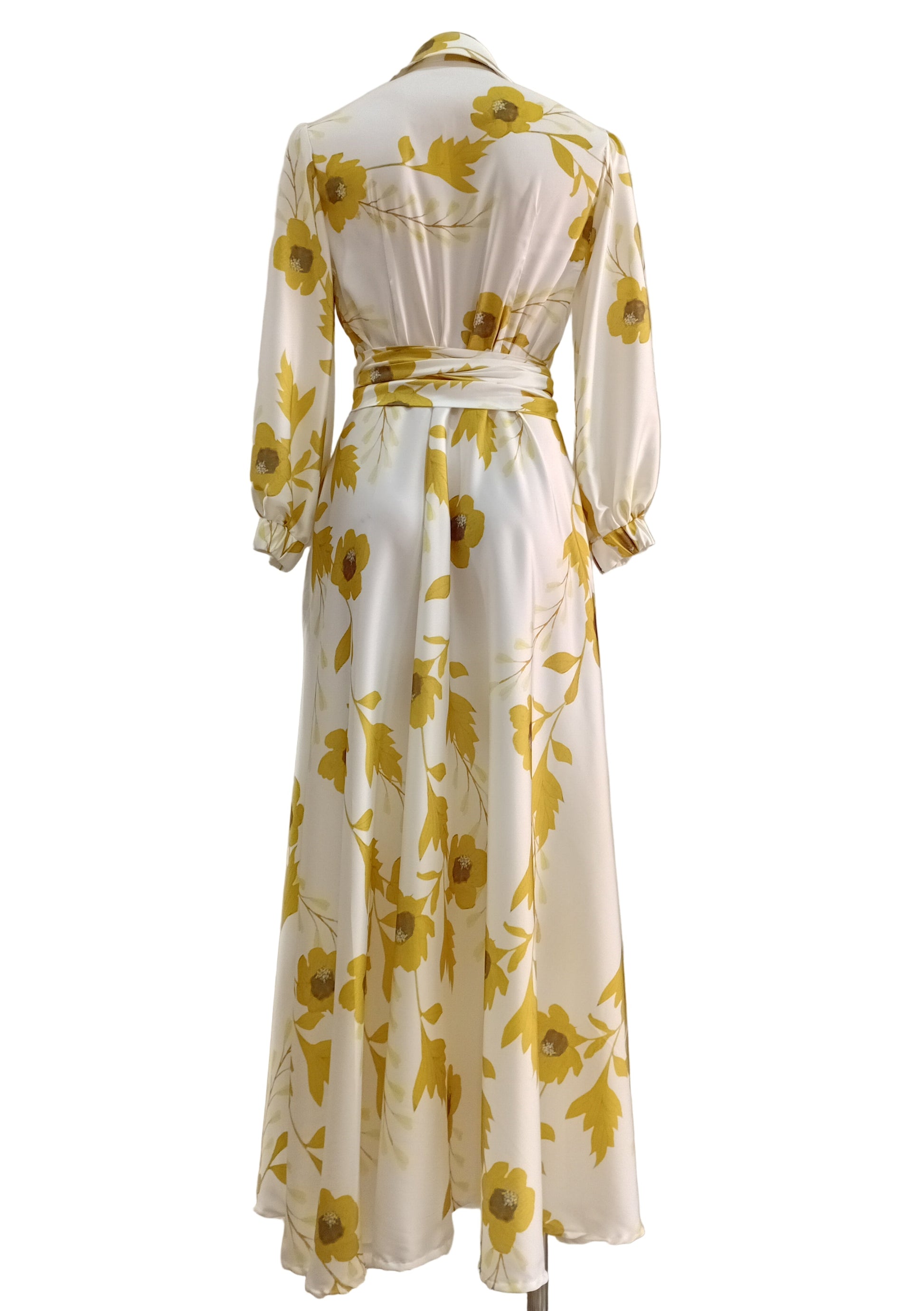 Shirtwaister dress with yellow floral pattern on a white background