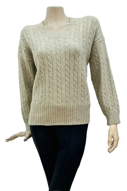 Stone cable knit sweater on a mannequin against a plain background