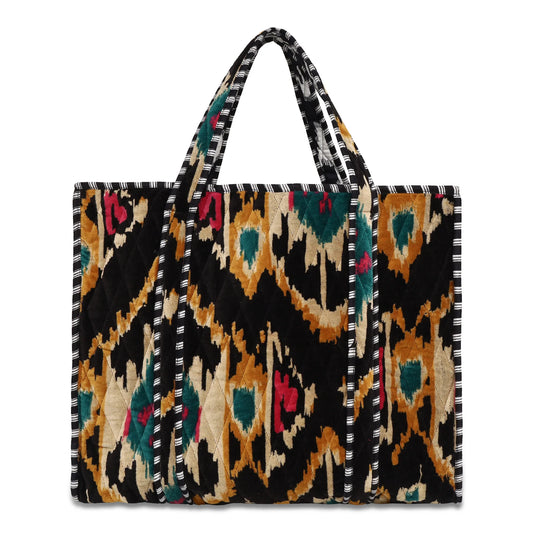 Tote bag with a colorful geometric pattern on a black background