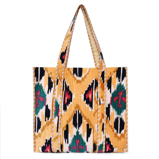 Tote bag with a colorful geometric pattern on a orange background