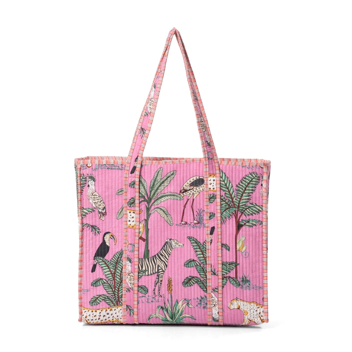 Pink tote bag with animal and plant pattern on a pink background
