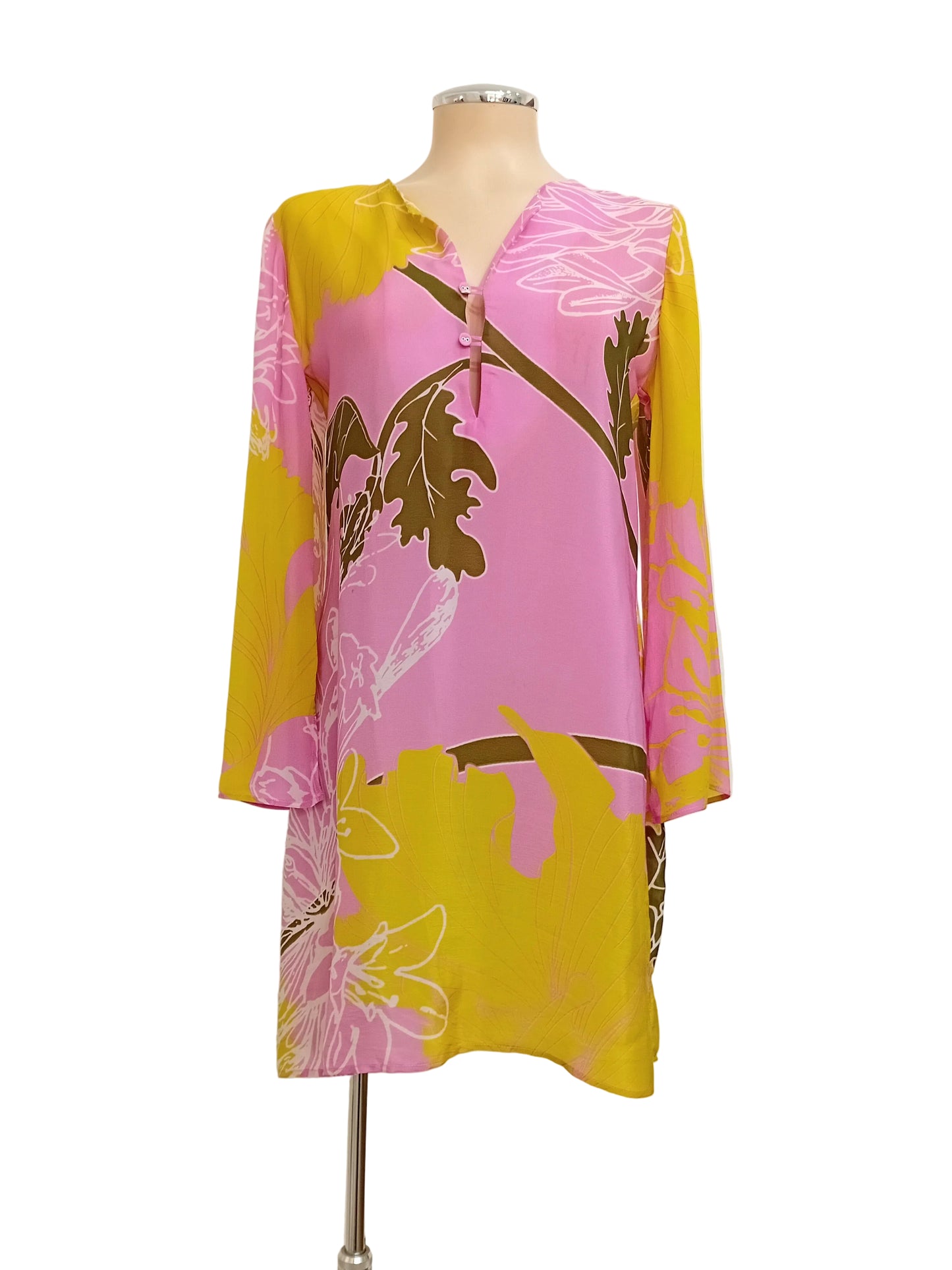 Tunic dress with pink and yellow lime floral print with a plain background