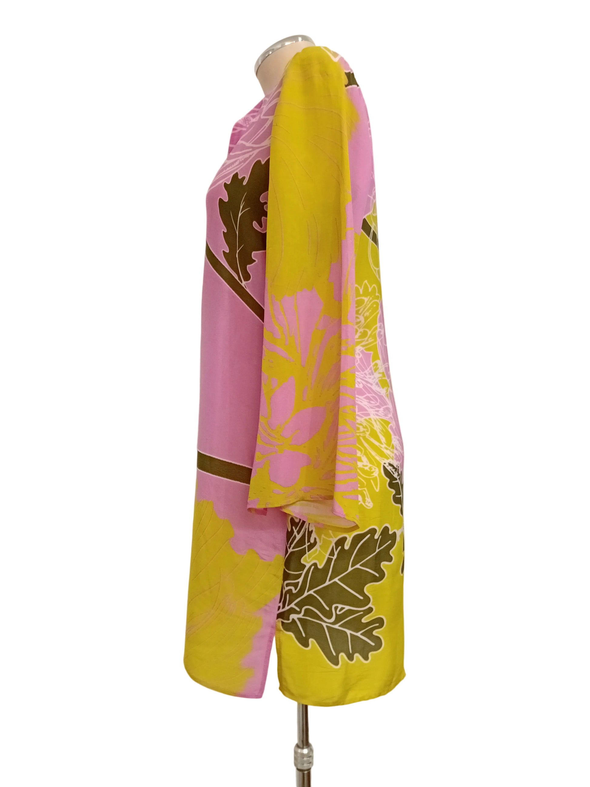 Tunic dress with pink floral and yellow lime print with a plain background