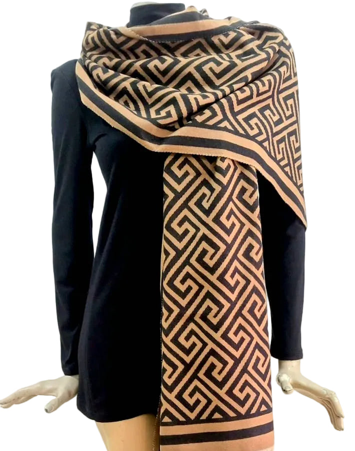 Mannequin with a patterned caramel and black scarf on a white background