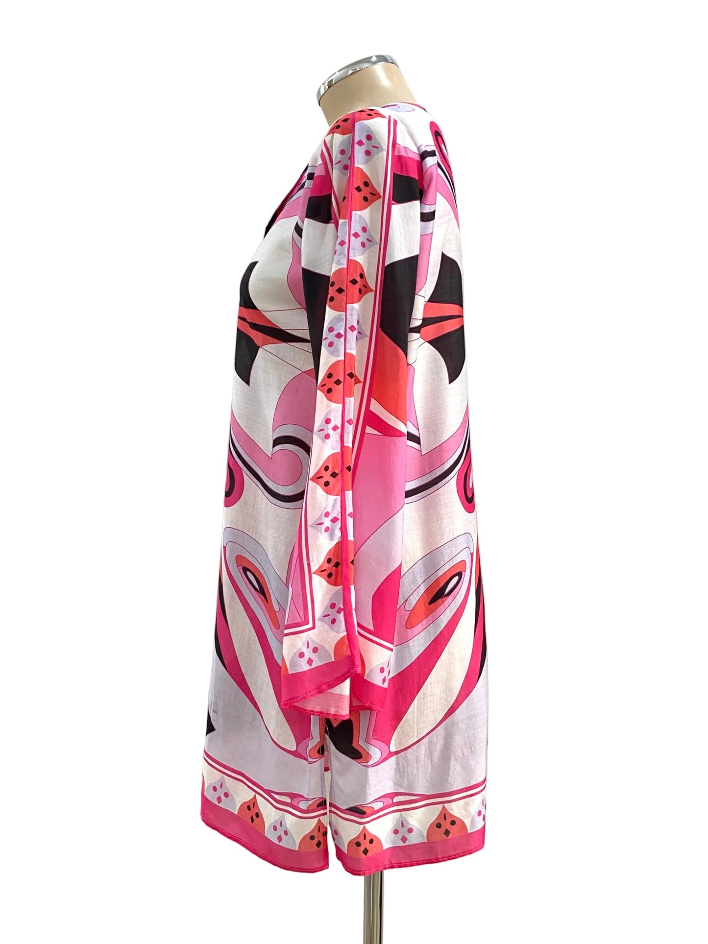 Mannequin wearing a colorful patterned dress against a white background