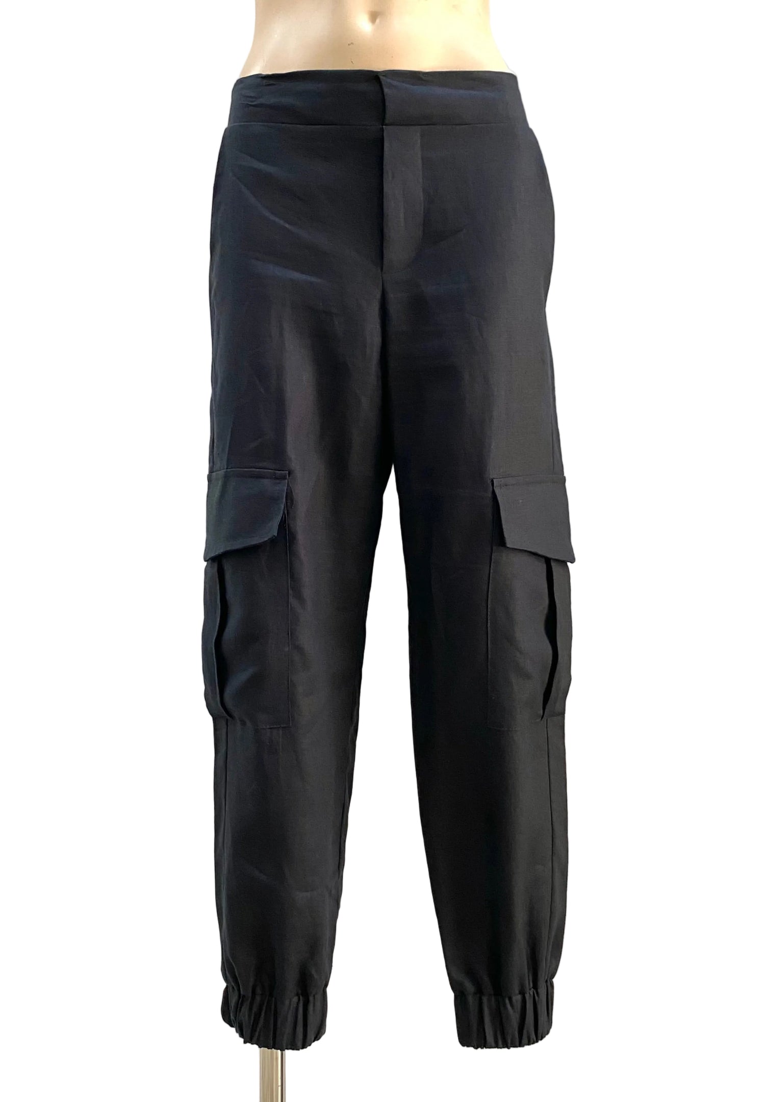 Black cargo pants on a mannequin against a white background