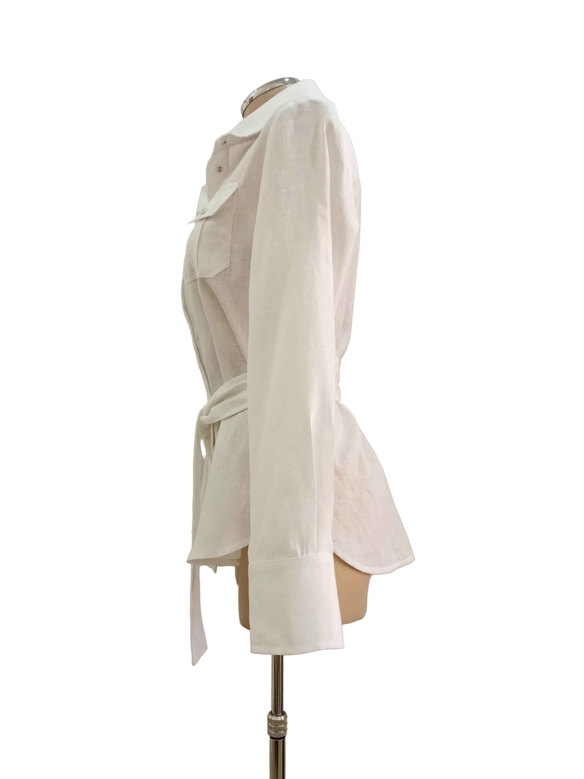 White linen shirt on a mannequin against a plain background