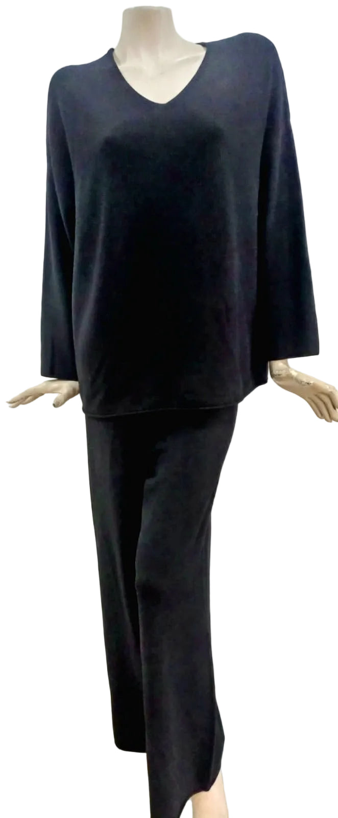 Black v neck track top and pant on a mannequin against a plain background