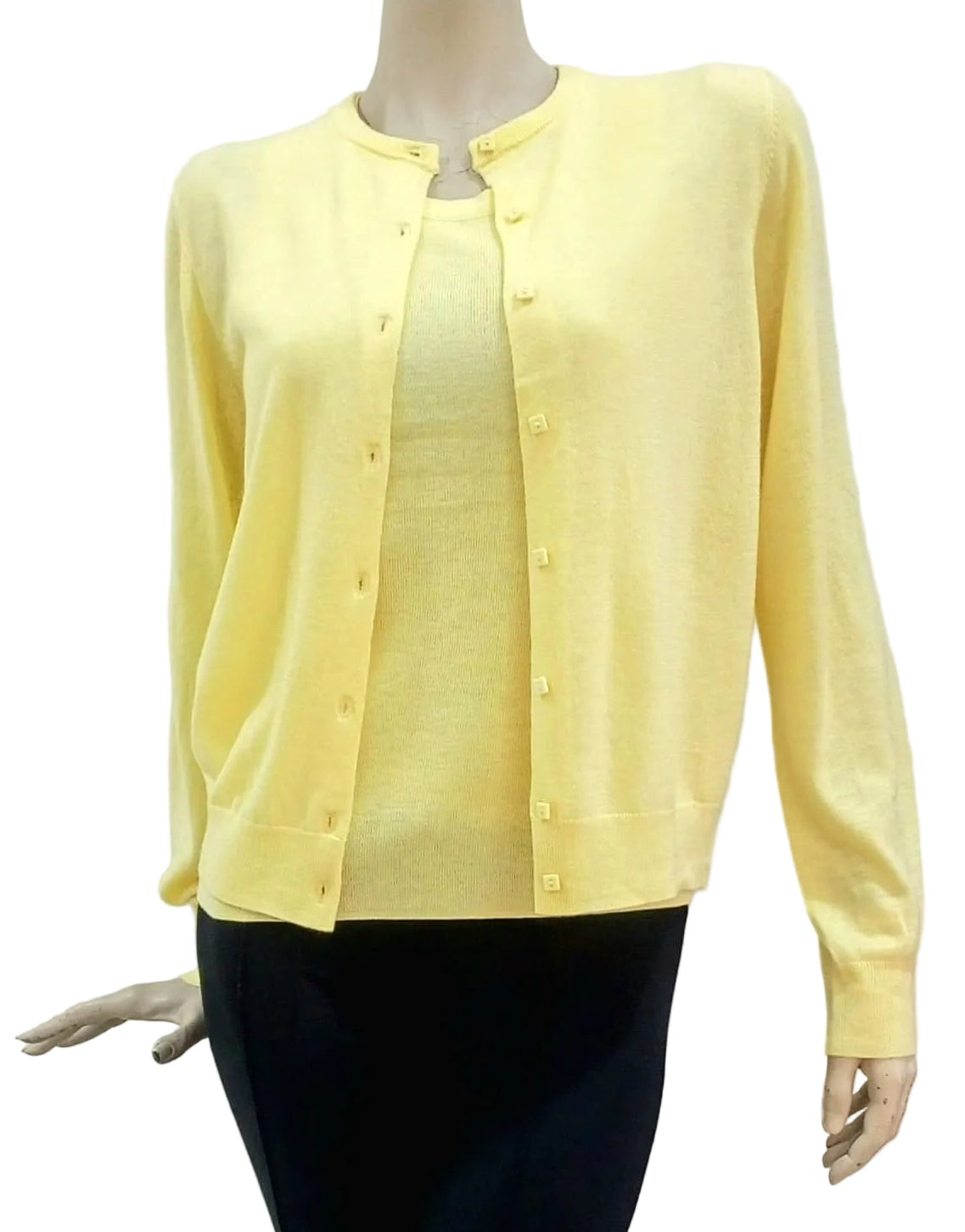 Yellow cardigan and cami on a mannequin against a white background