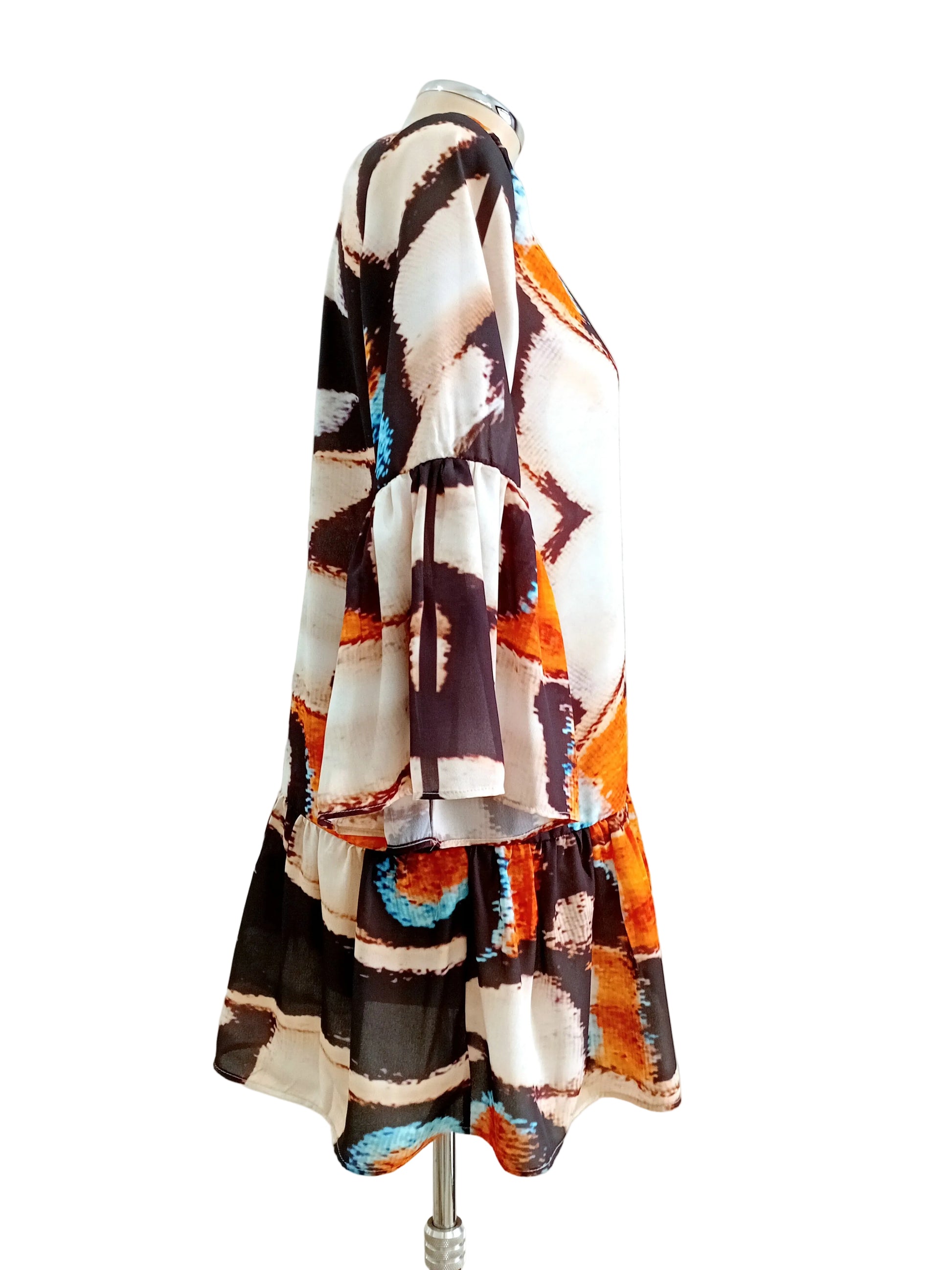 Colorful patterned Zen Butterfly dress against a white background